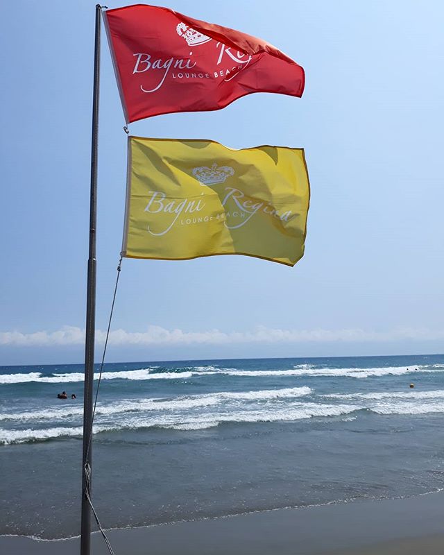 Through the wind.#wind #bagniregina #flag #yellow #red #sunshine #seaside #bluesky #bluesea #hot #summer #luglio #mare #blu #sole #vento #beach #photo #picture #picoftheday #scatto #like #colors #vsco #camera #nice